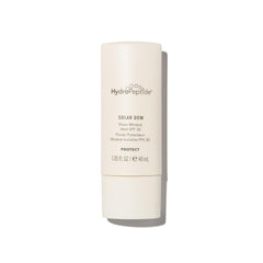HydroPeptide Solar Dew Mineral Melt bottle on desk showing weightless mineral SPF protection