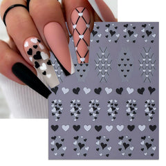 Minimalist black-white heart line design on nails using IDDFEVE stickers.
