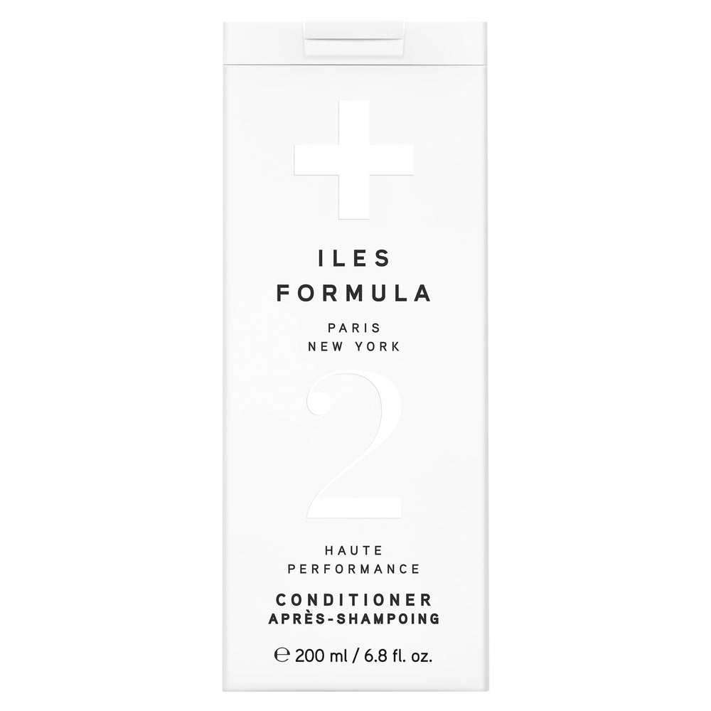 ILES FORMULA conditioner bottle pour demonstrates easy application and weightless moisture.