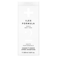 ILES FORMULA conditioner bottle pour demonstrates easy application and weightless moisture.