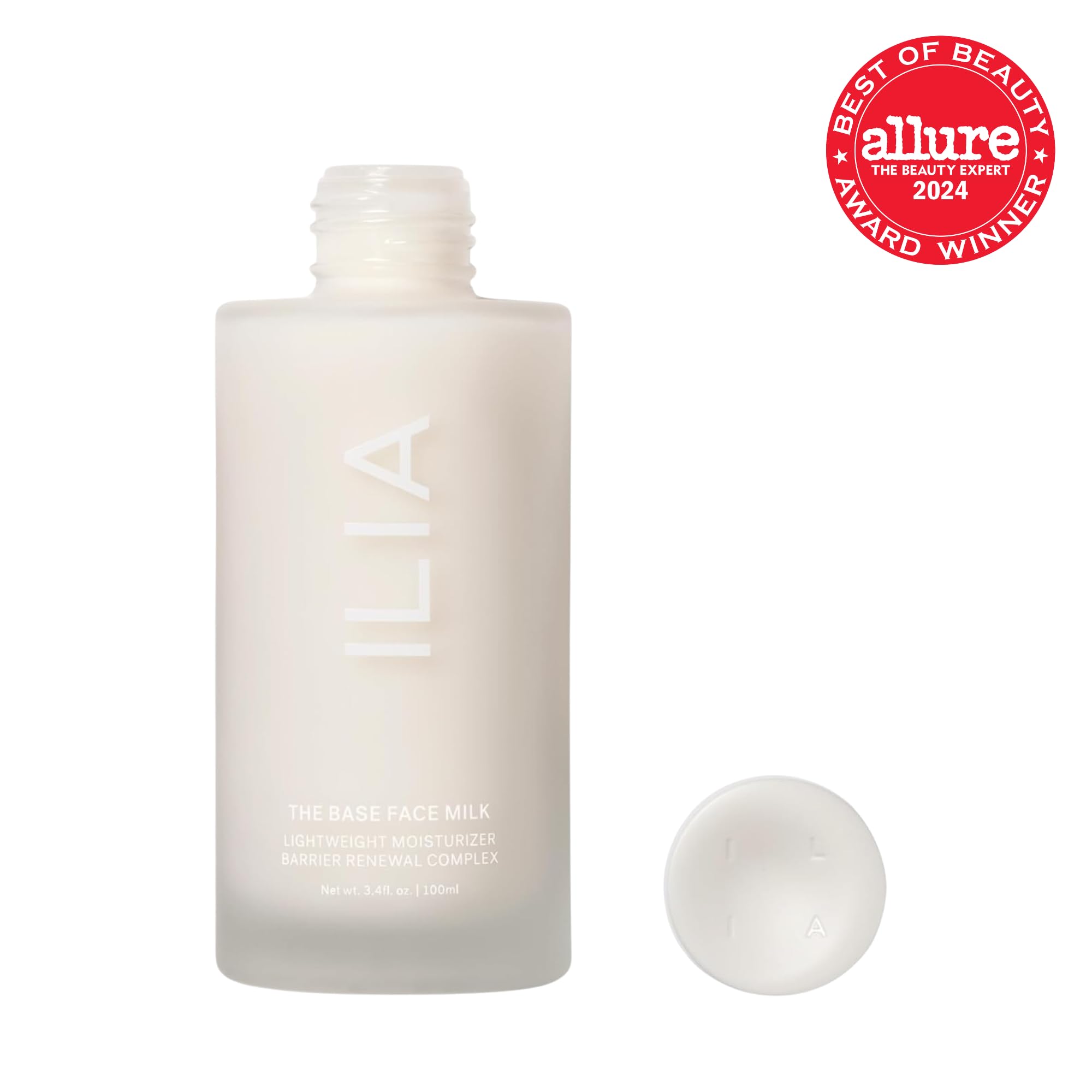 Closeup of ILIA Base Face Milk Essence packaging shows a clean, vegan formula.