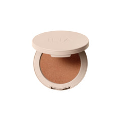 ILIA Lightshift Cream Highlighter in Daze warm copper swatch showing radiant glow.