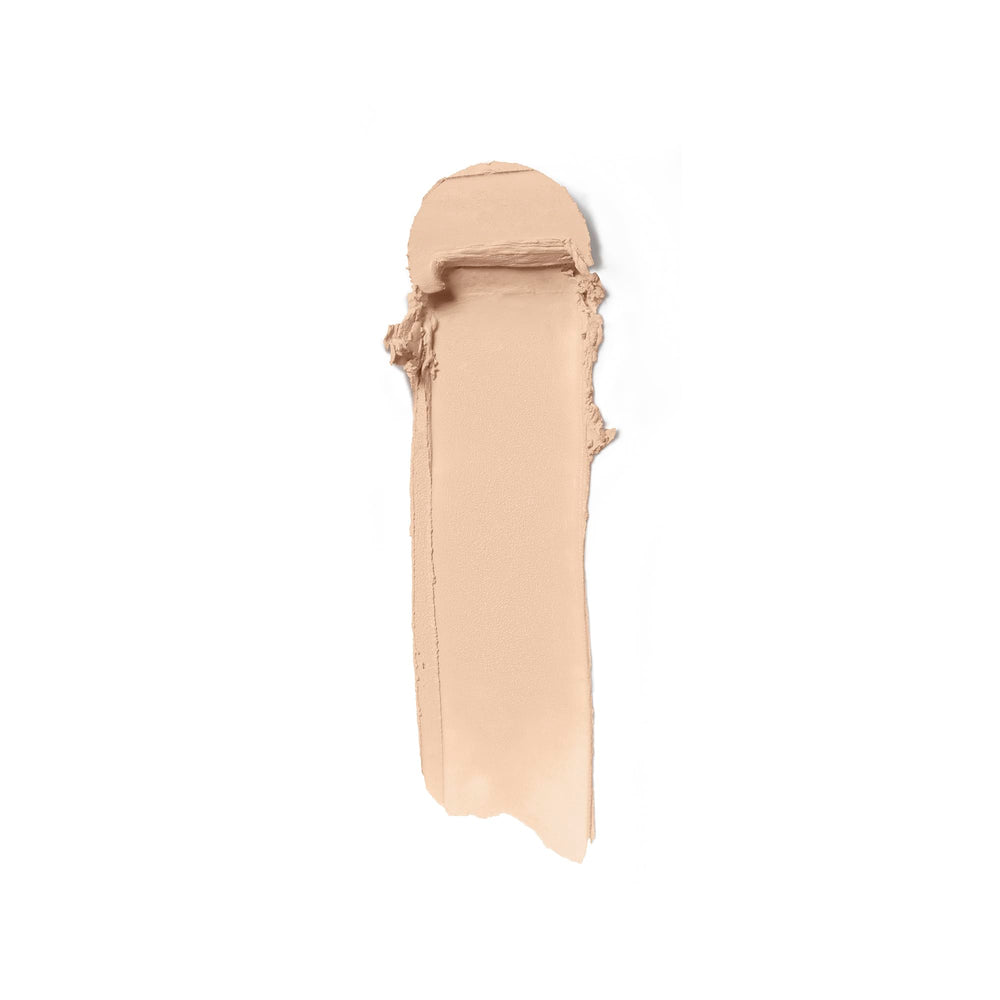 ILIA Skin Rewind stick on hand demonstrates buildable coverage with a natural matte finish.