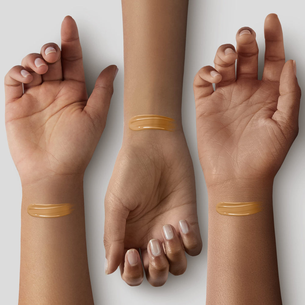 ILIA bottle and applicator close-up emphasizing lightweight formula for everyday wear.