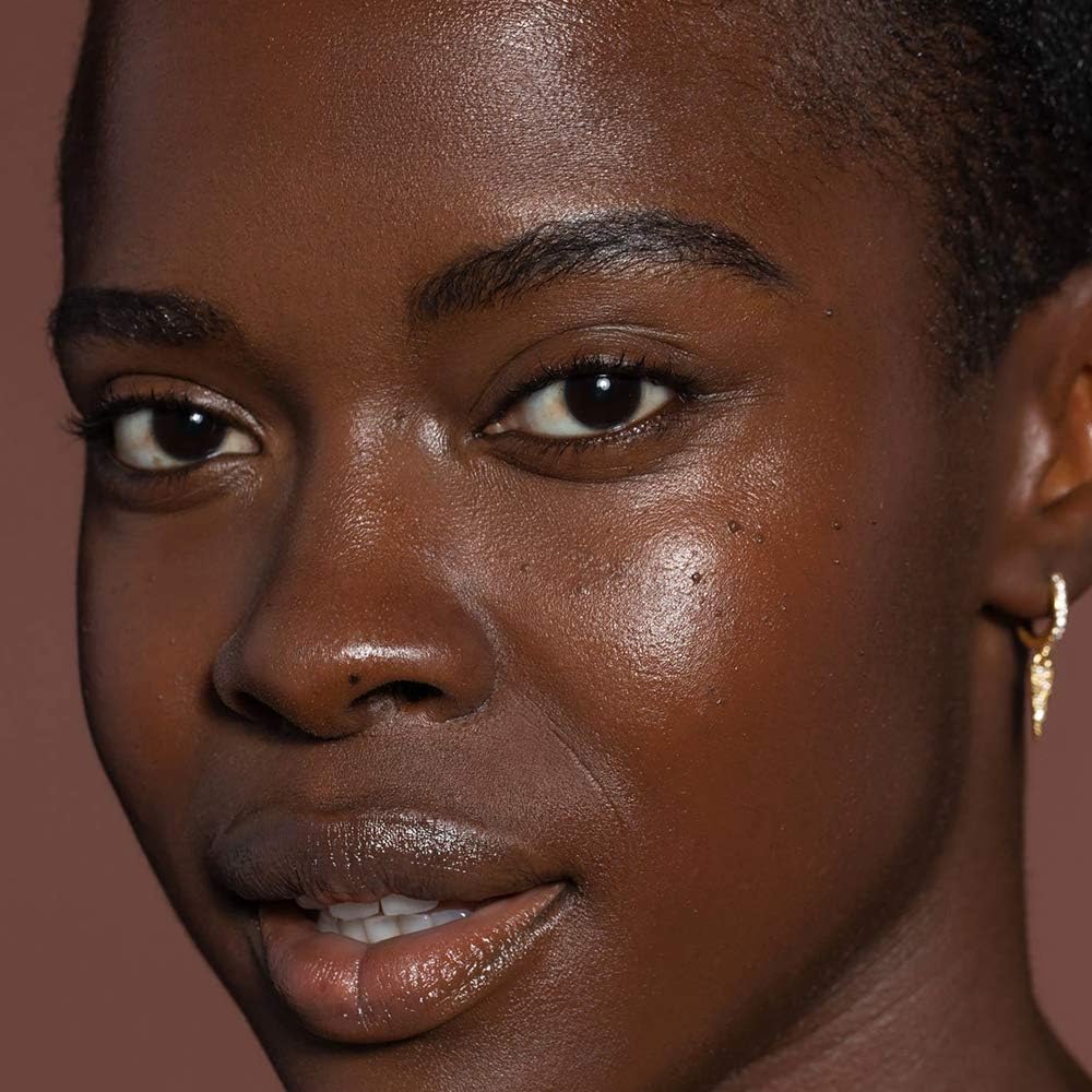 Vegan cruelty-free icons beside ILIA tint packaging for clean beauty