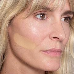 Close-up ILIA foundation swatch blended for skin-like result.