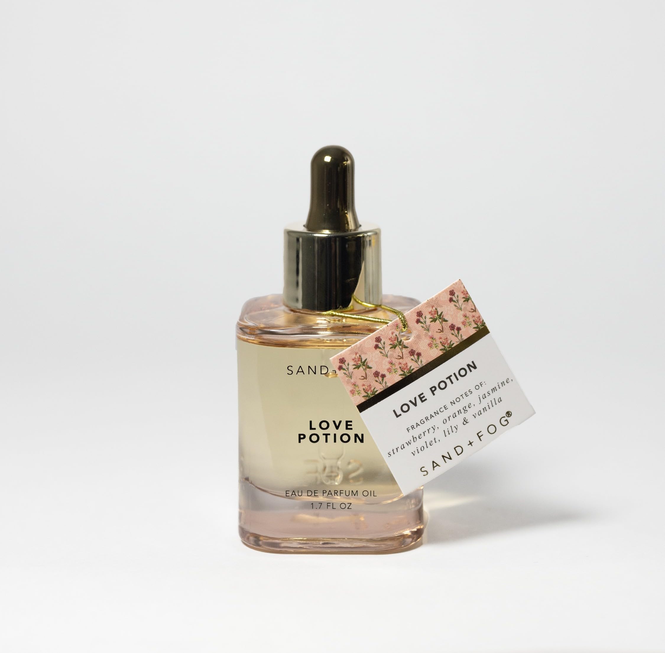 Sand + Fog Love Potion dropper in action showing precise application to pulse points