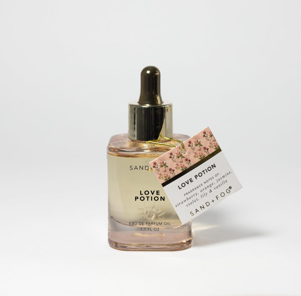 Sand + Fog Love Potion dropper in action showing precise application to pulse points