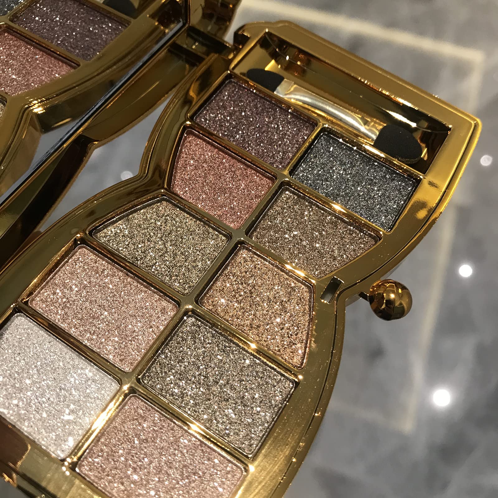 Impeccablery glitter eyeshadow palette, open case showing vibrant gold shades for daily looks.