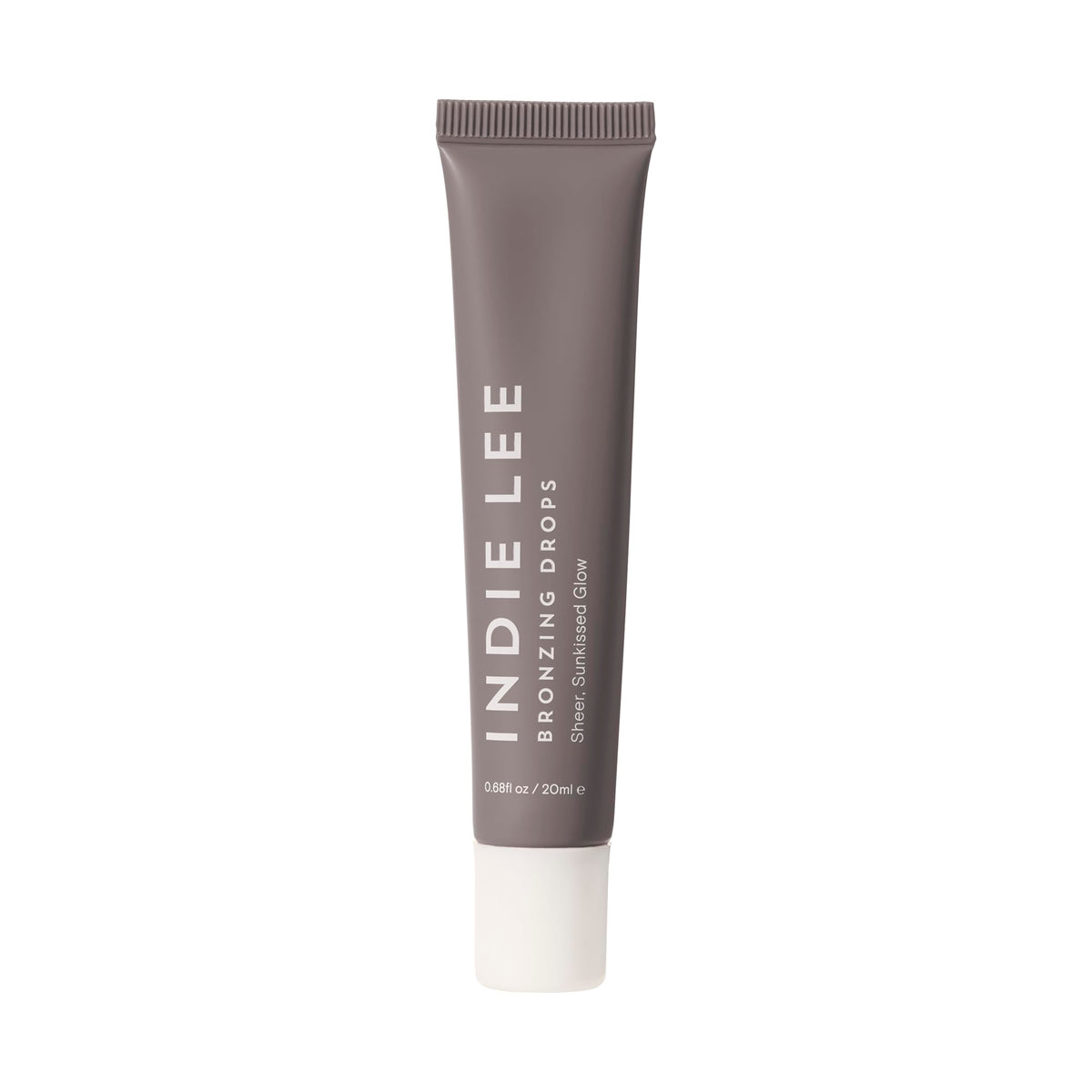 Indie Lee Bronzing Drops on face and body create a natural, hydrating glow.