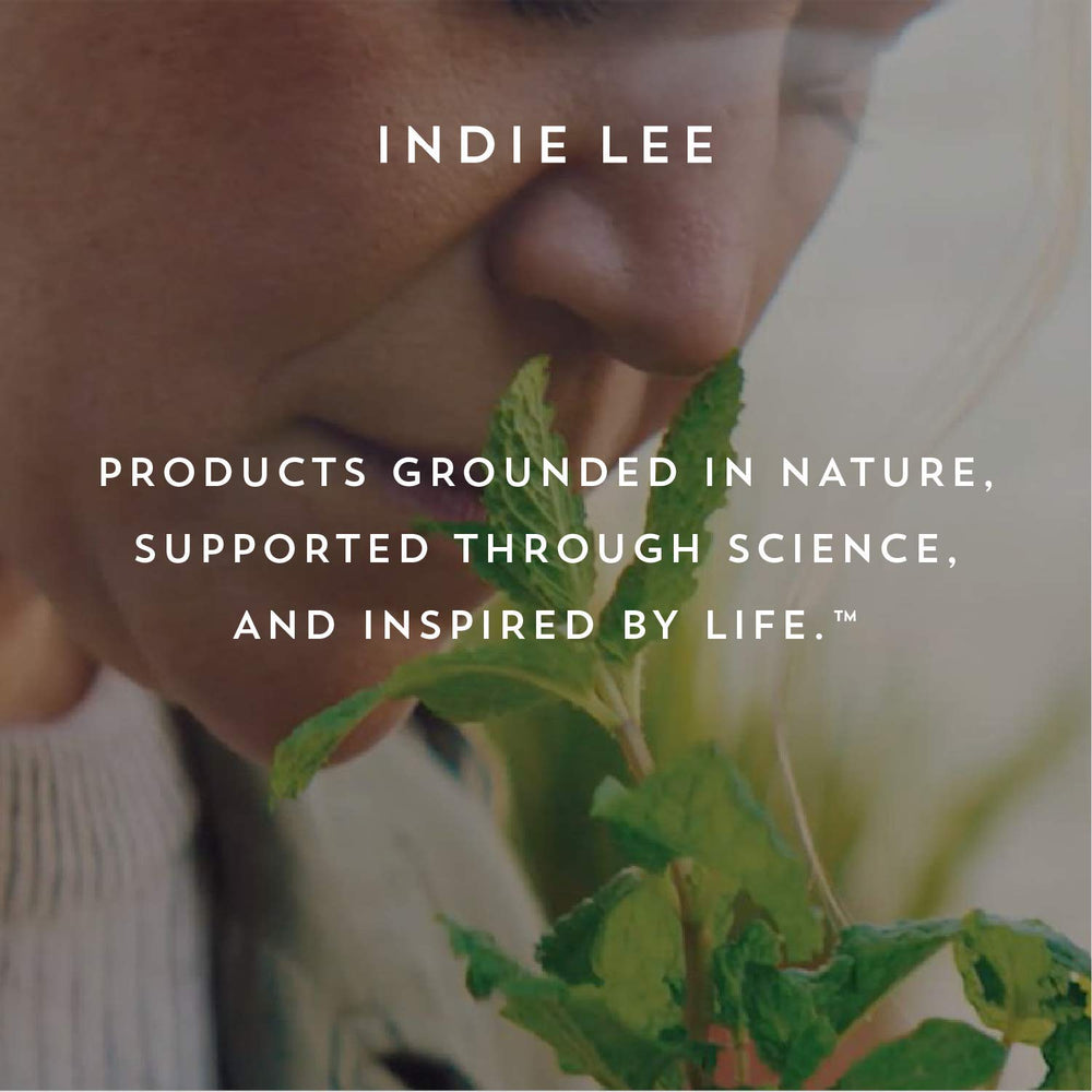 Applied Indie Lee Daily Vitamin Infusion on skin suggesting even hydration