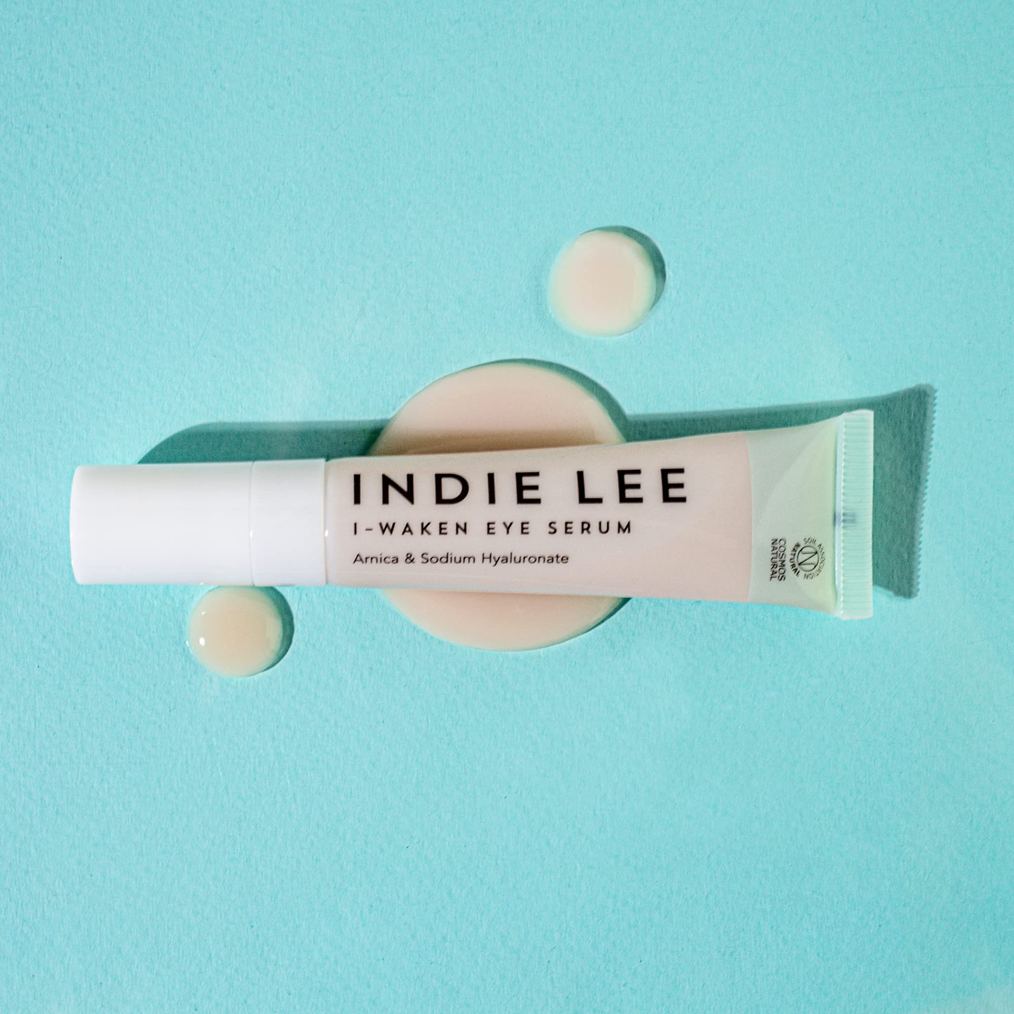 Indie Lee I-Waken applicator demonstrates cooling, soothing under-eye application