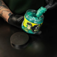 INK-EEZE Mutant Serum green ointment swatch shows smooth post-tattoo care.