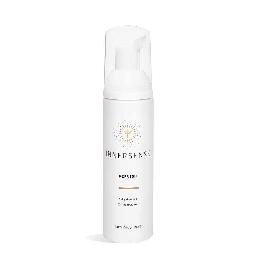 INNERSENSE Organic Beauty Dry Shampoo bottle shows an oil-absorbing formula for refreshed hair.