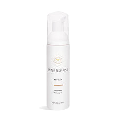 INNERSENSE Organic Beauty Dry Shampoo bottle shows an oil-absorbing formula for refreshed hair.