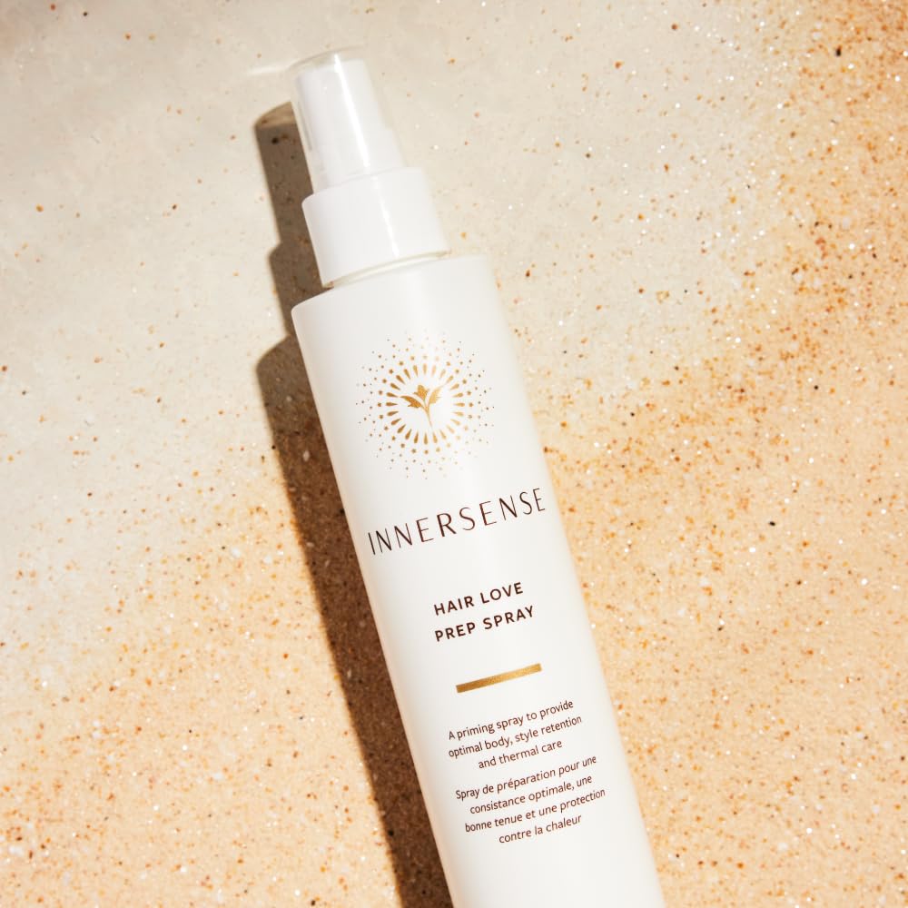 INNERSENSE Organic Hair Prep Spray mist being applied to hair for heat preparation.