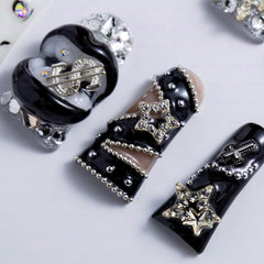IntoVibes duck-shaped nails with elegant length enhance finger silhouette for striking style.