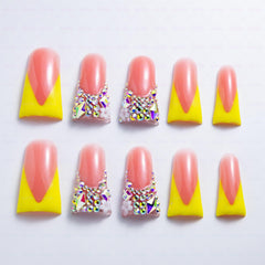 IntoVibes duck-shape nails in yellow gloss for bold party looks.