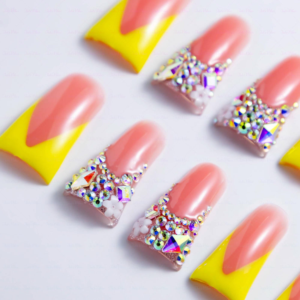 IntoVibes yellow French acrylic nails with elongated duck tip.