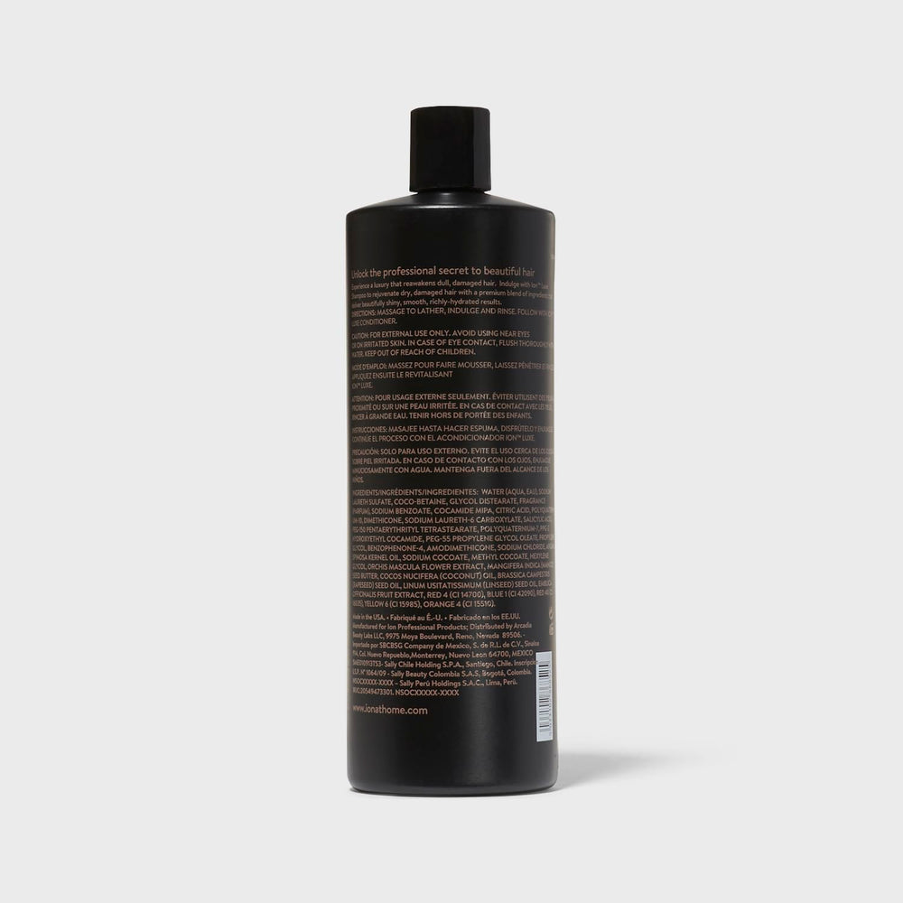 Ion Luxe Shampoo being applied to hair for hydration.