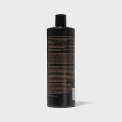 Ion Luxe Shampoo being applied to hair for hydration.