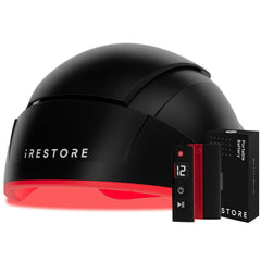 iRestore Elite cap on the head during an at-home red light therapy session.