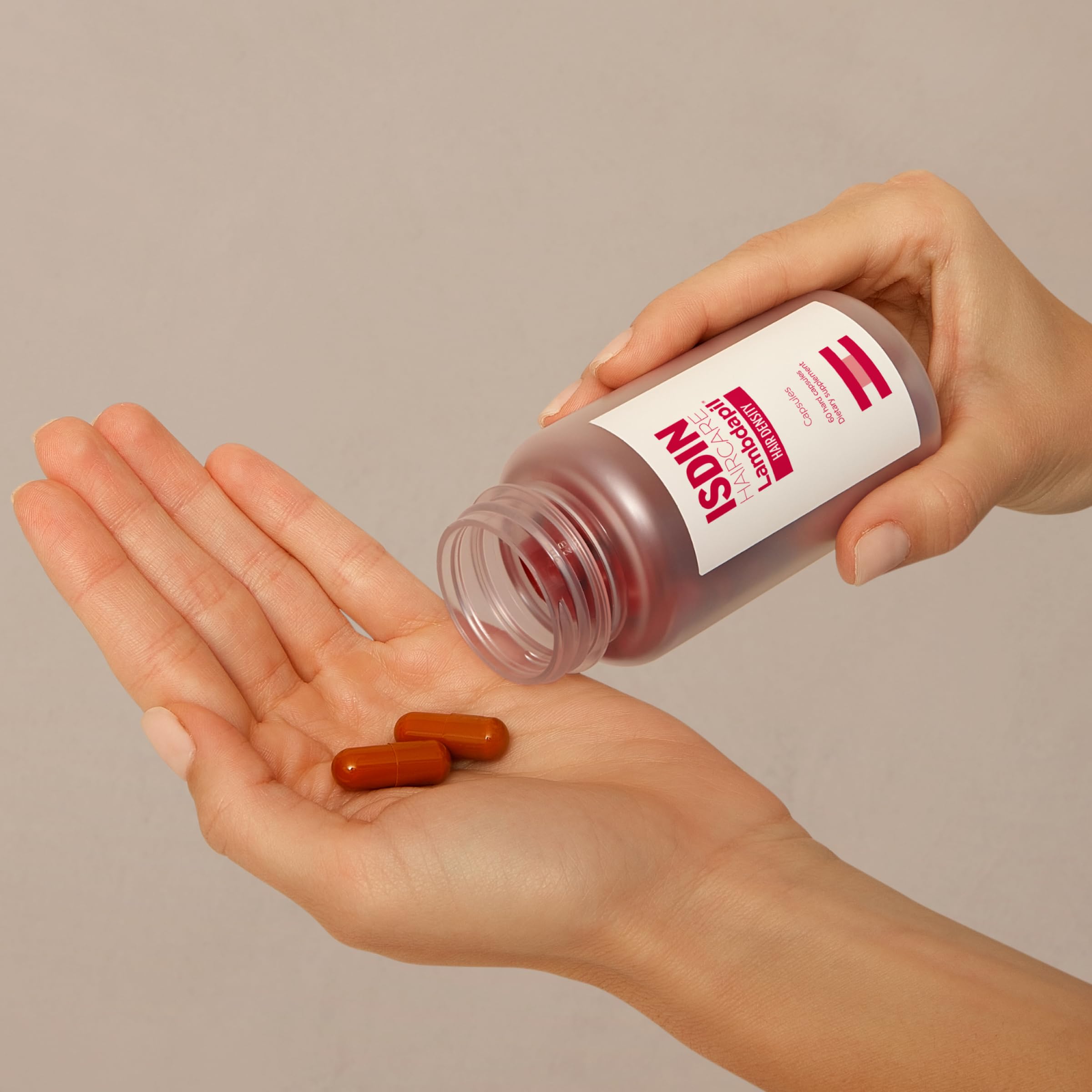 ISDIN Lambdapil capsules closeup emphasizing vitamin-rich formula for hair nourishment