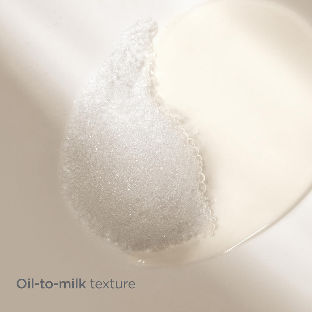 Isdinceutics Essential Cleansing Oil texture-emulsion shows oil-to-milk transformation.