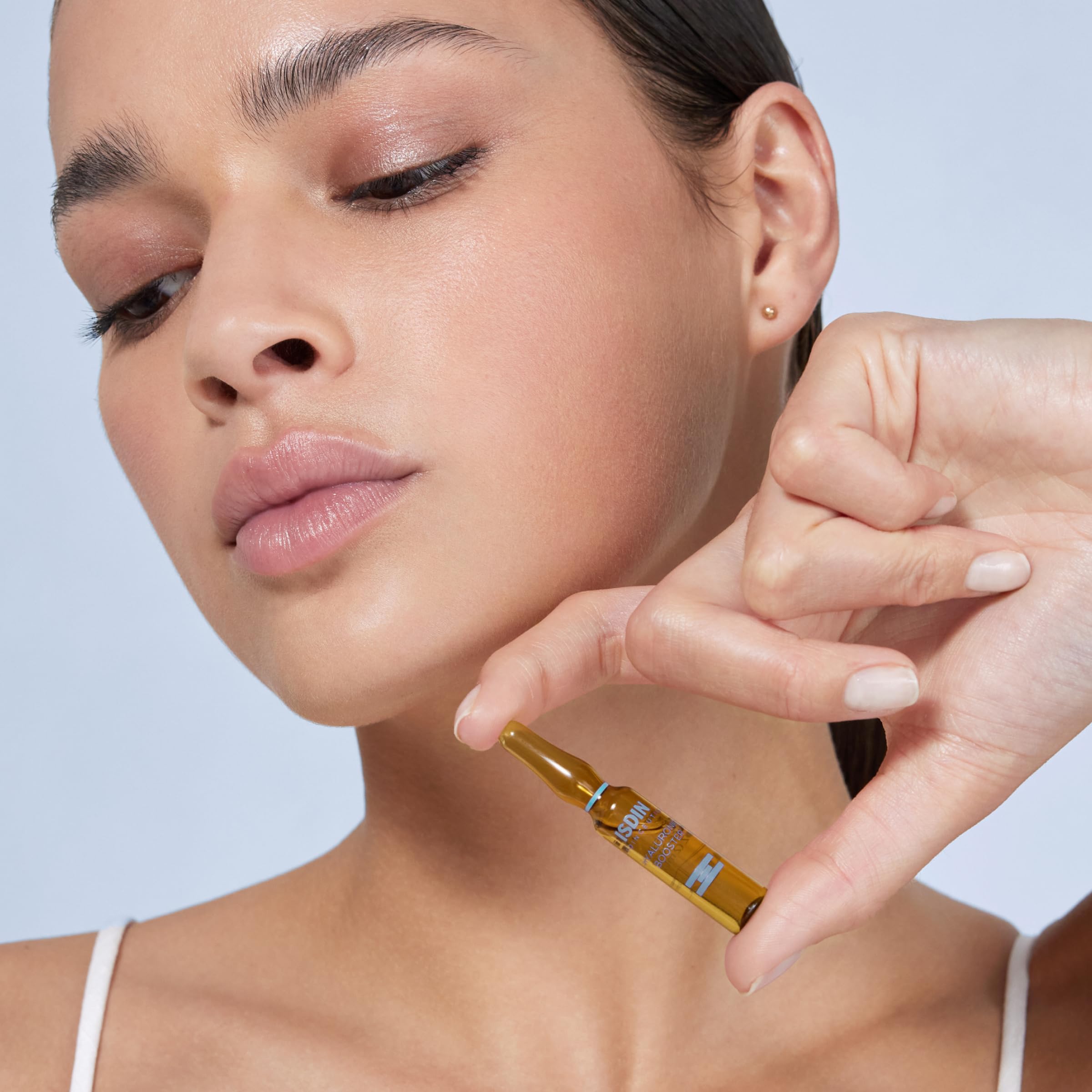 Isdinceutics ampoule close-up bottle highlights lightweight, non greasy feel