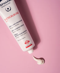 IsisPharma anti-redness cream application on face shows gentle, controlled soothing action.