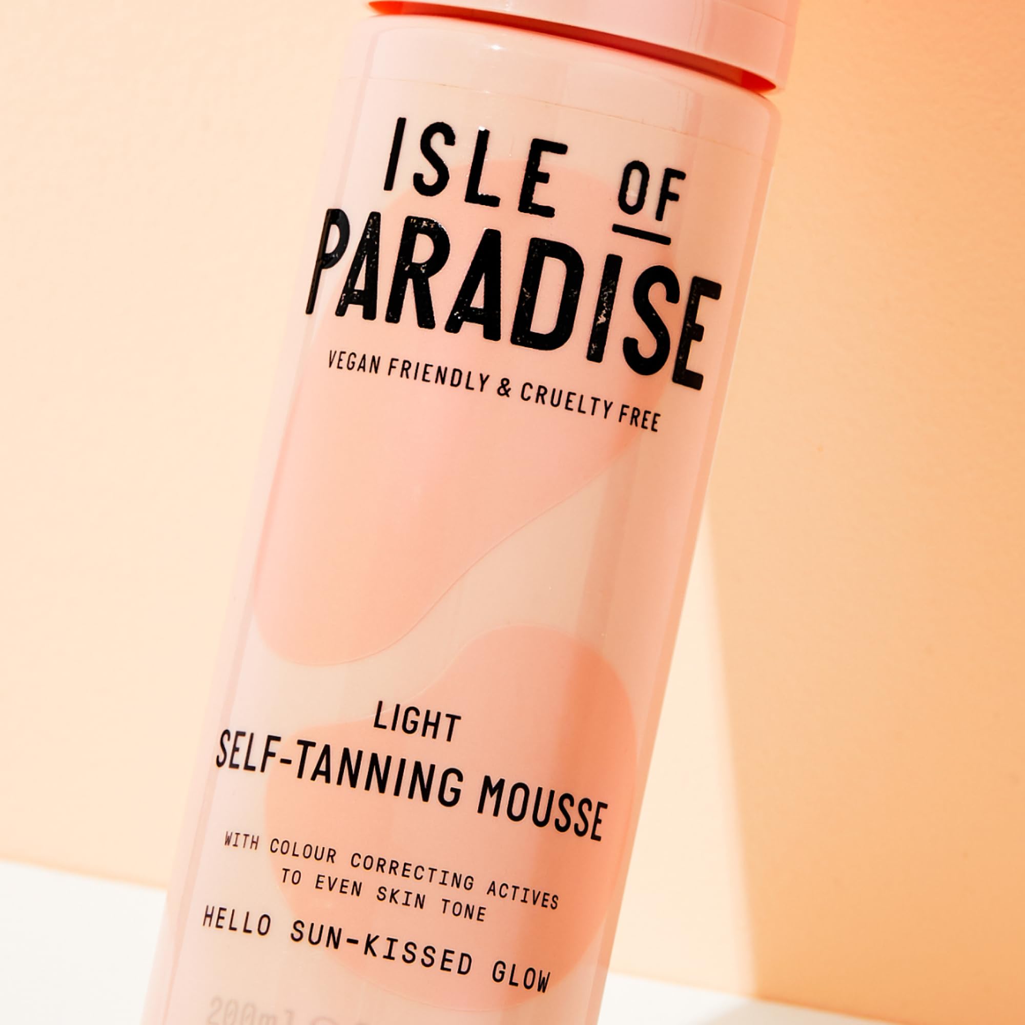 Isle of Paradise mousse applied by hand for a natural glow.