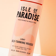 Isle of Paradise mousse applied by hand for a natural glow.