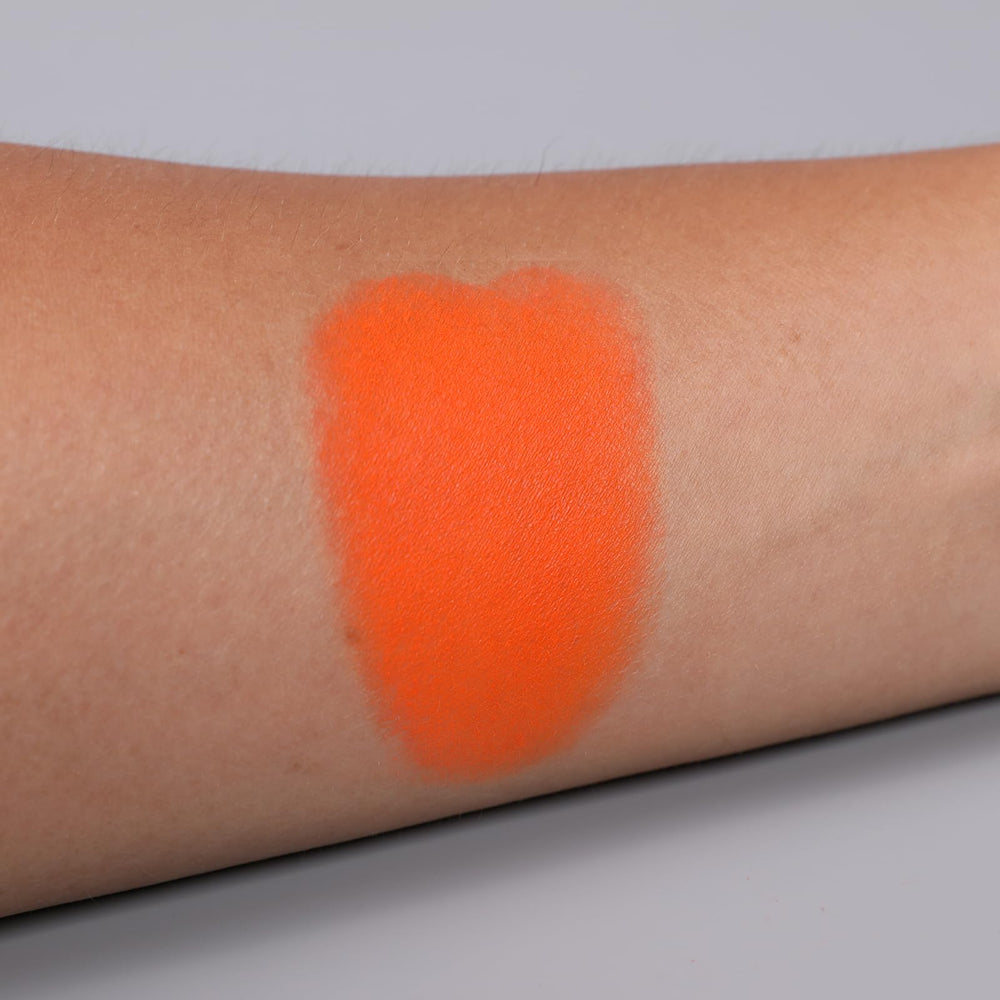 IS'MINE orange matte eyeshadow worn on eyelid for a vivid everyday look.