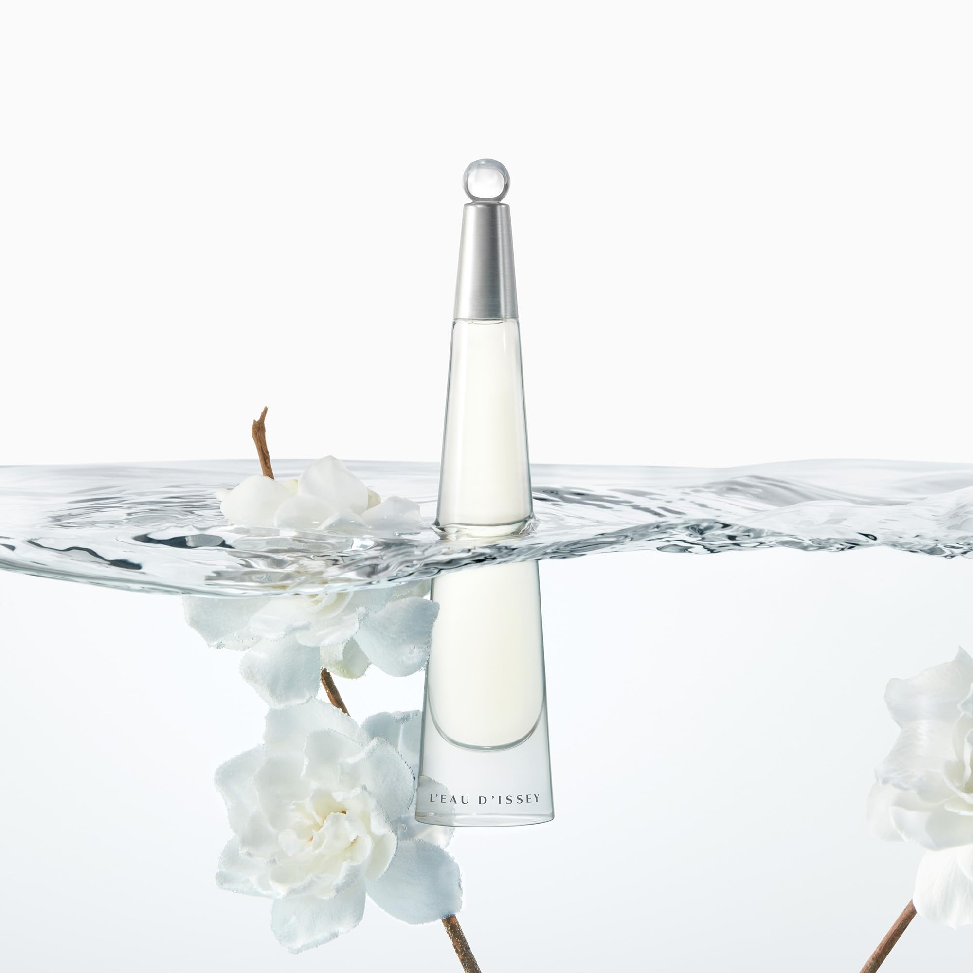 Issey Miyake L'Eau d'Issey floral notes close-up emphasizes lotus and white flowers.