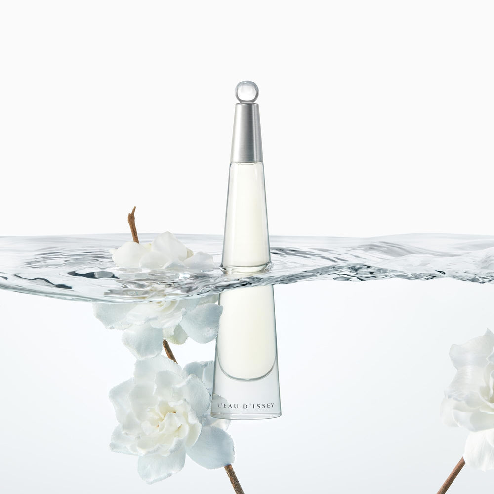 Issey Miyake L'Eau d'Issey floral notes close-up emphasizes lotus and white flowers.