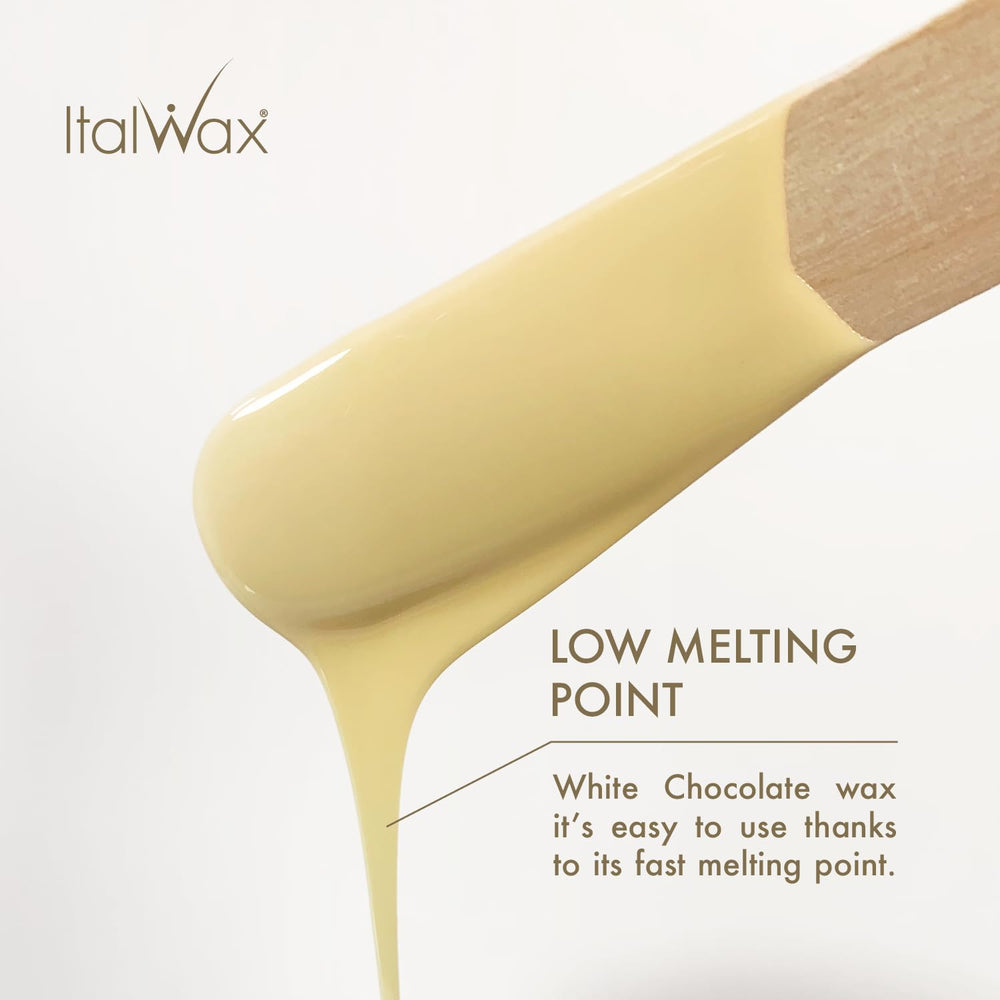 Spatula applying warm Italwax wax for bikini area prep.
