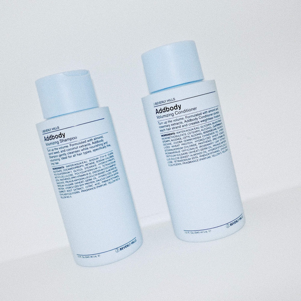 J Beverly Hills Blue Addbody shampoo lather shown in hand for rich cleansing
