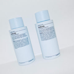J Beverly Hills Blue Addbody shampoo lather shown in hand for rich cleansing