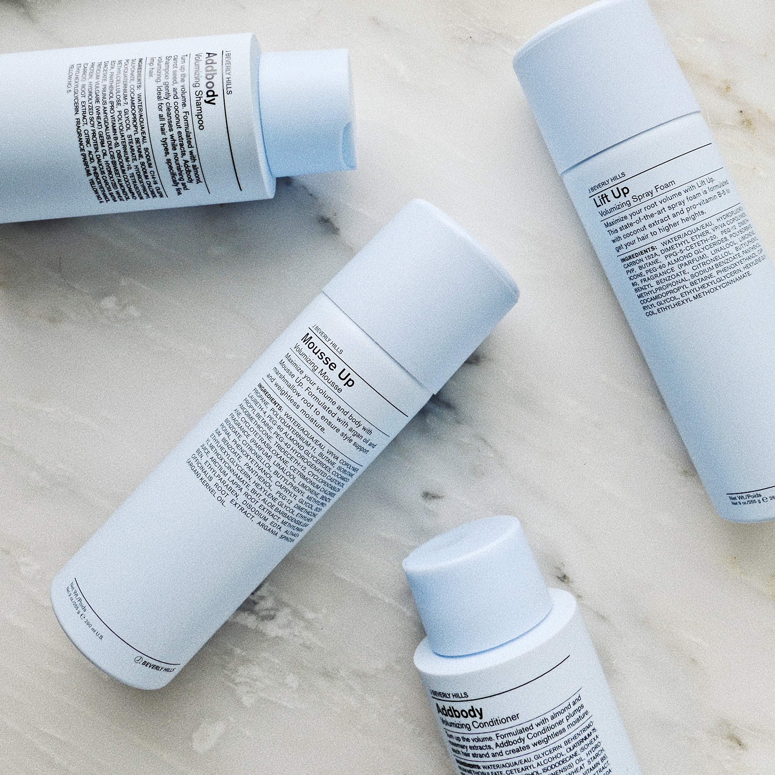J Beverly Hills Blue Addbody shampoo on shower shelf with conditioner pairing