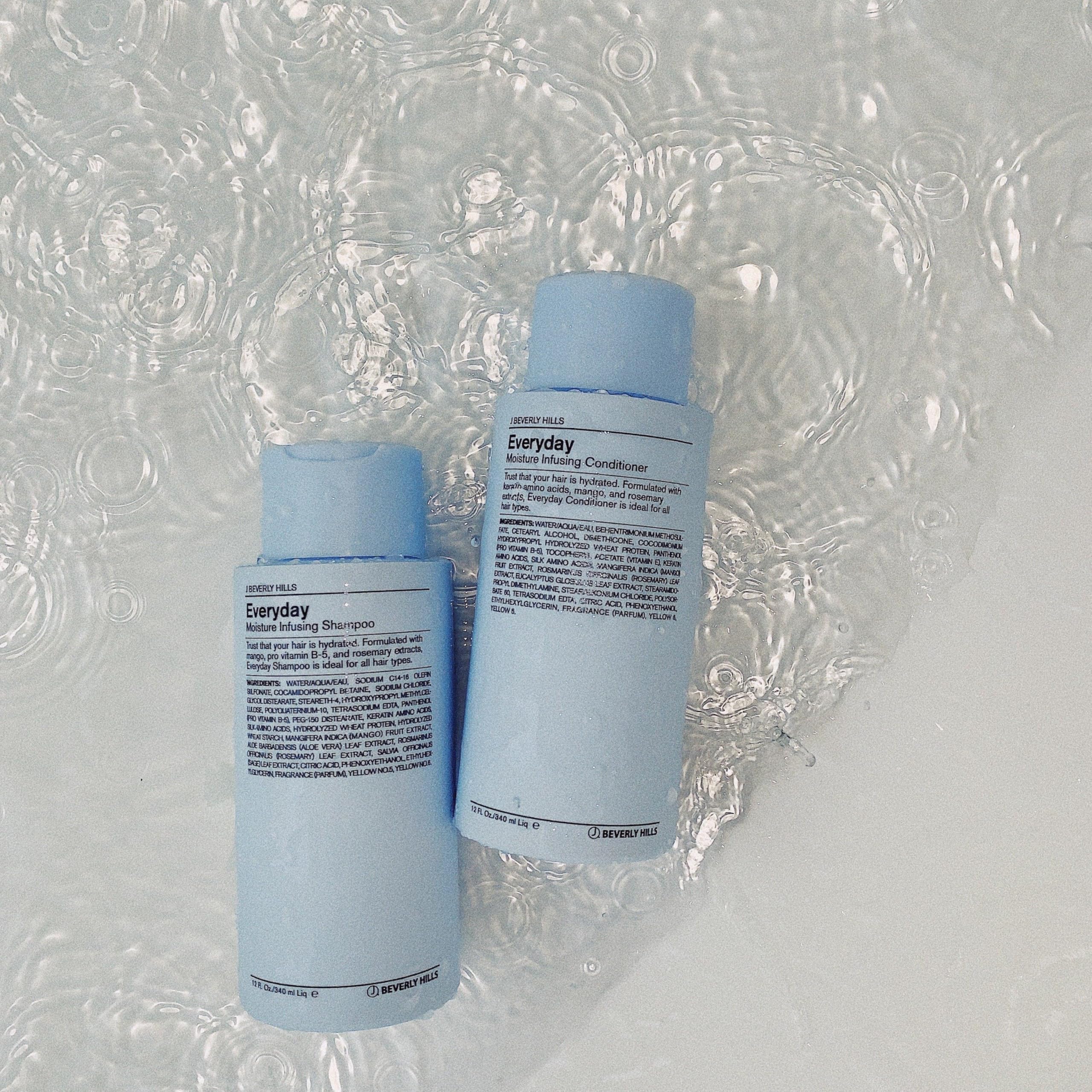 J Beverly Hills Blue Everyday Moisturizing Conditioner in shower; creamy texture for easy spread.