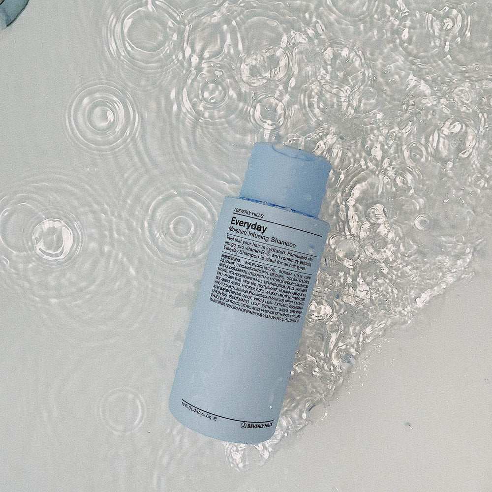 J Beverly Hills Blue Everyday Moisturizing Shampoo with mango extract for lasting moisture.