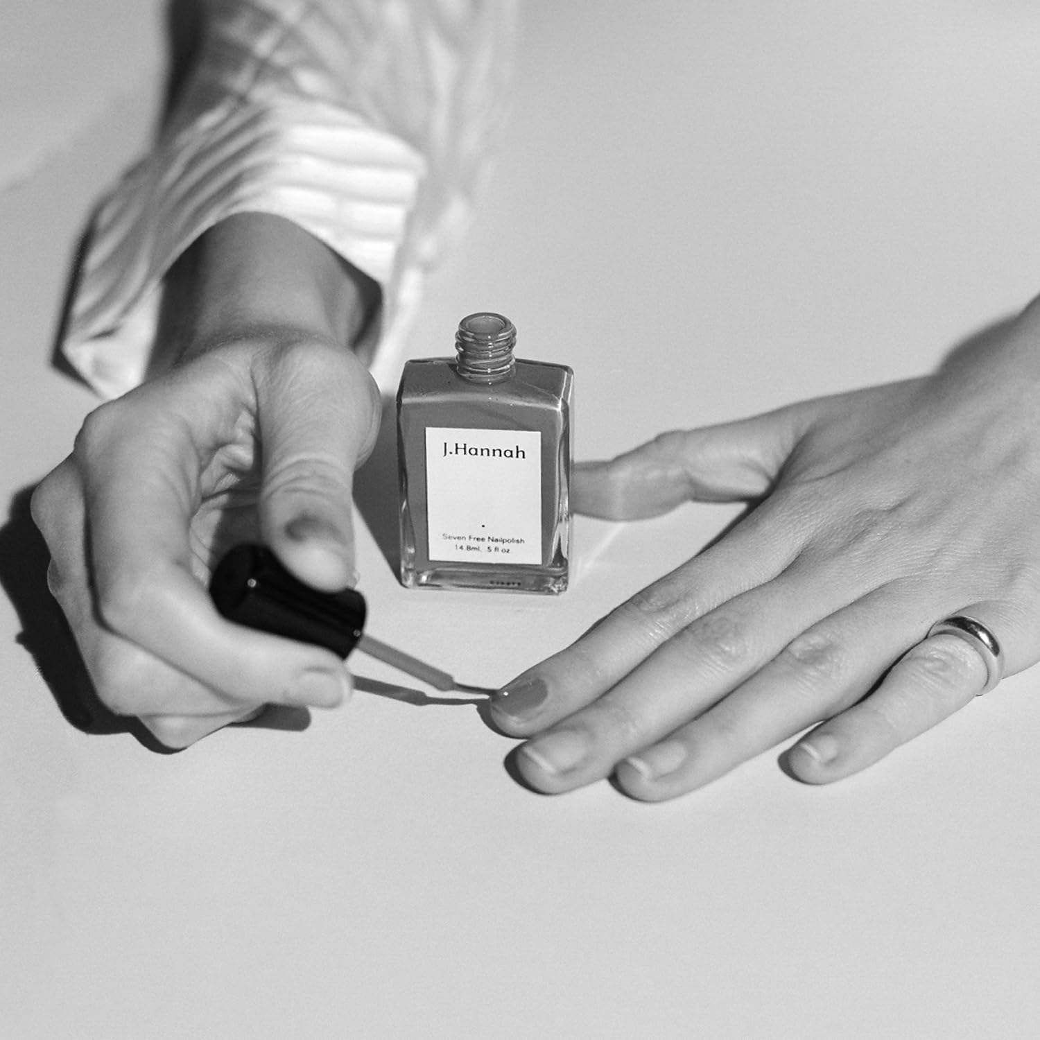J. Hannah cap and bottle highlight travel-friendly packaging.