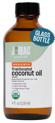 J Mac Botanicals Organic Fractionated Coconut Oil bottle on a clean counter for massage prep