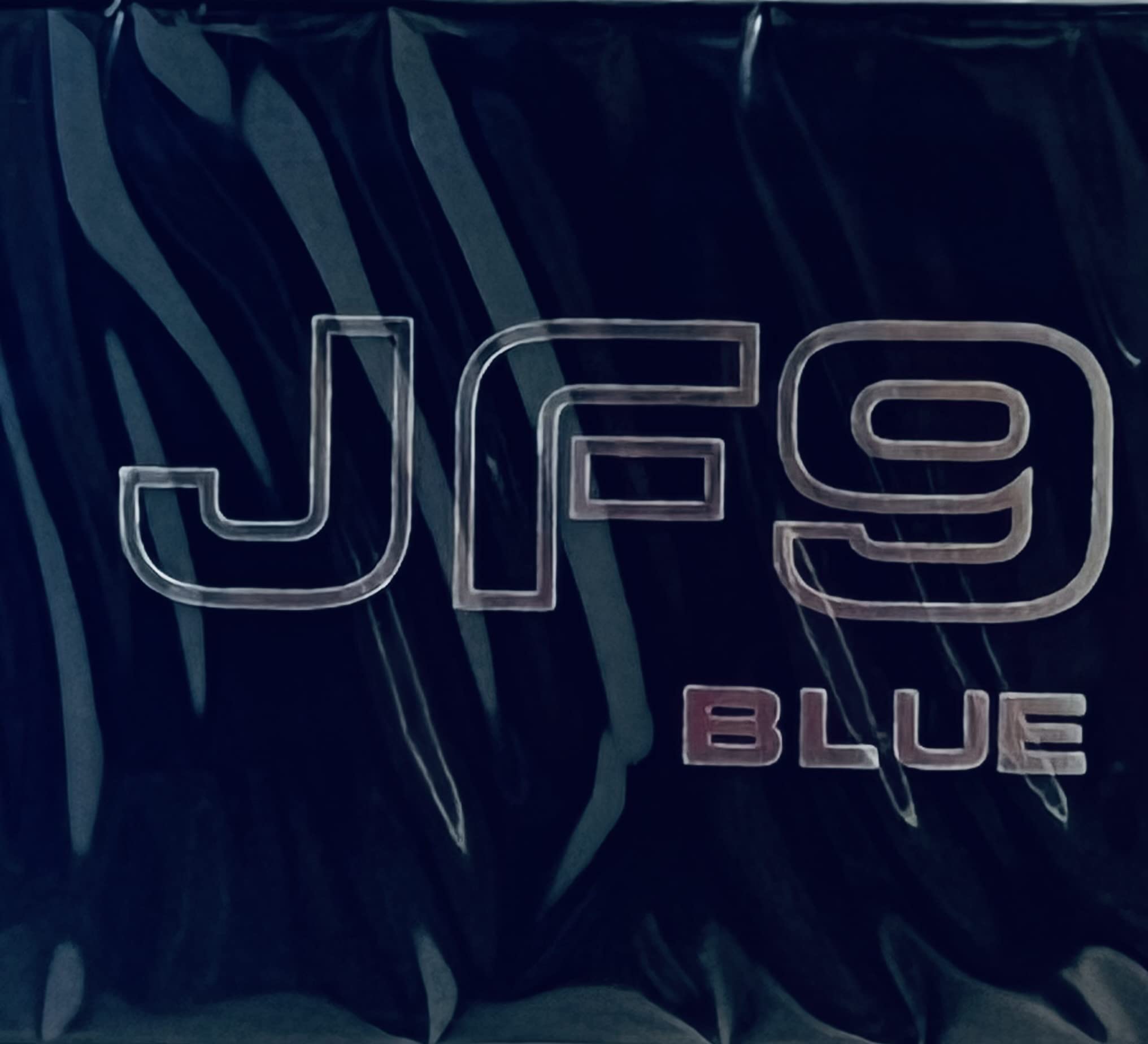 Jafra JF9 Blue Cologne on a clean surface with blue accents.