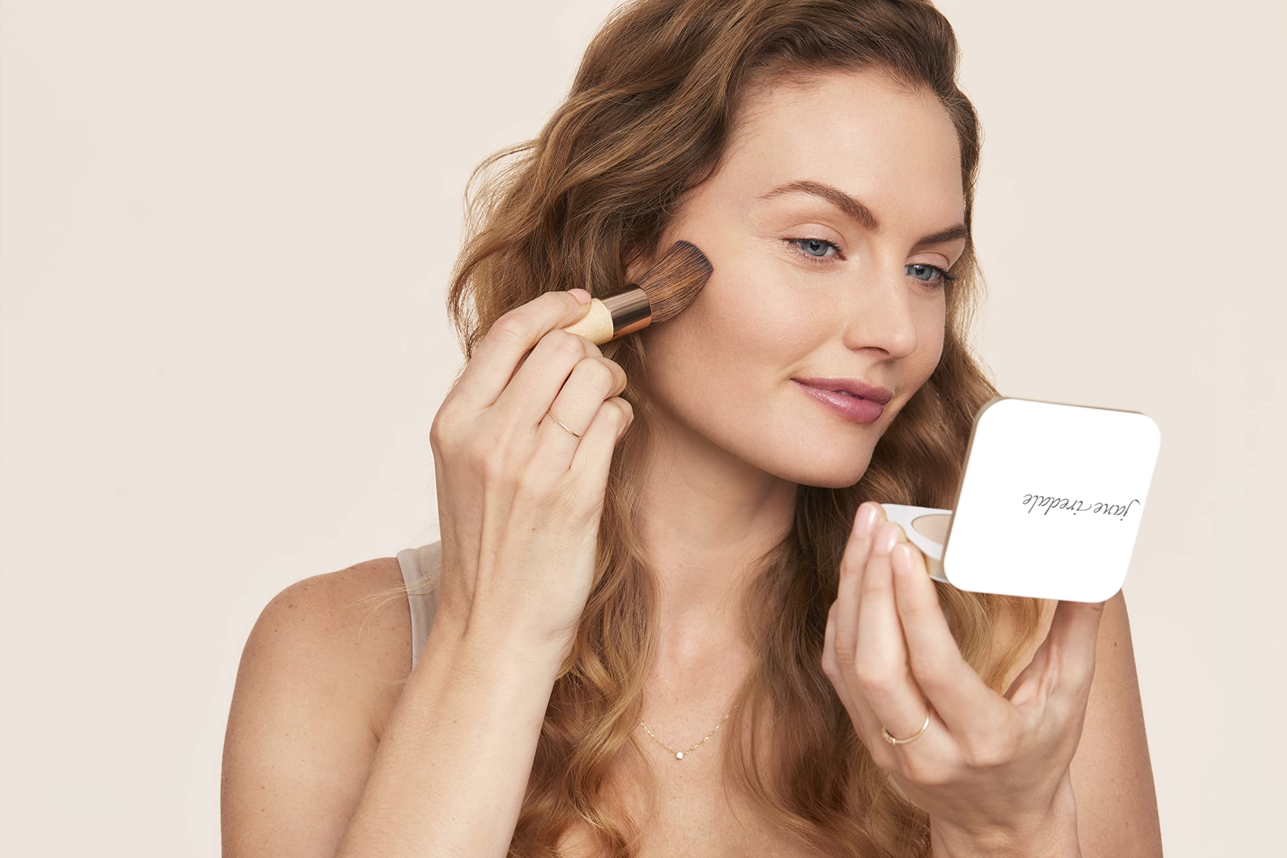 Jane Iredale PurePressed Base provides broad spectrum sunscreen in a compact.