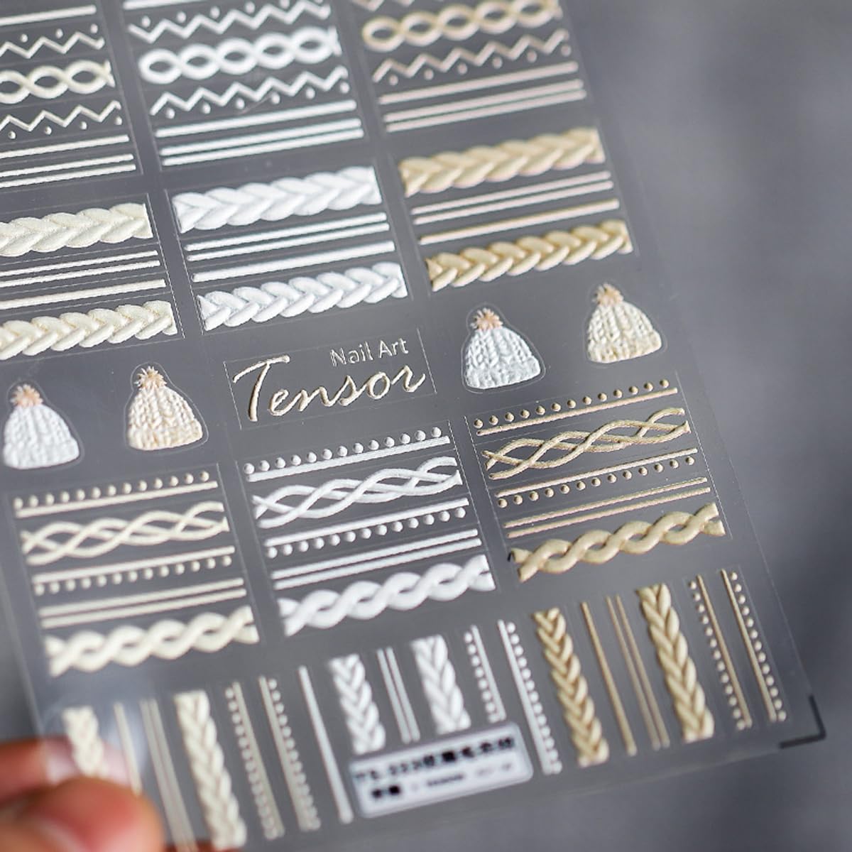 JIALITFUN weave sweater embossed stickers add textured, cozy nail art.