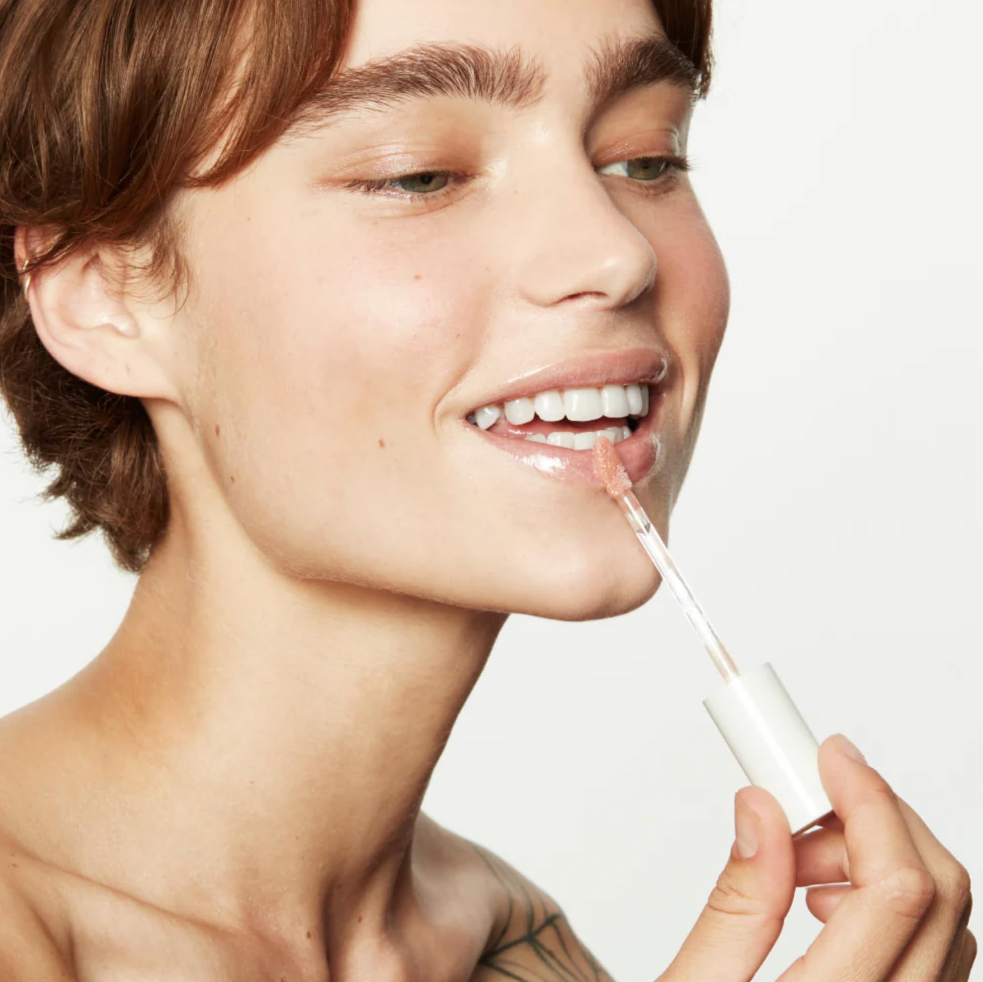 Premium packaging close-up of Jillian Dempsey Lip Gloss with vegan, clean formula