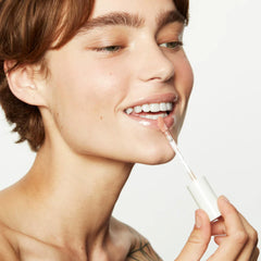 Premium packaging close-up of Jillian Dempsey Lip Gloss with vegan, clean formula