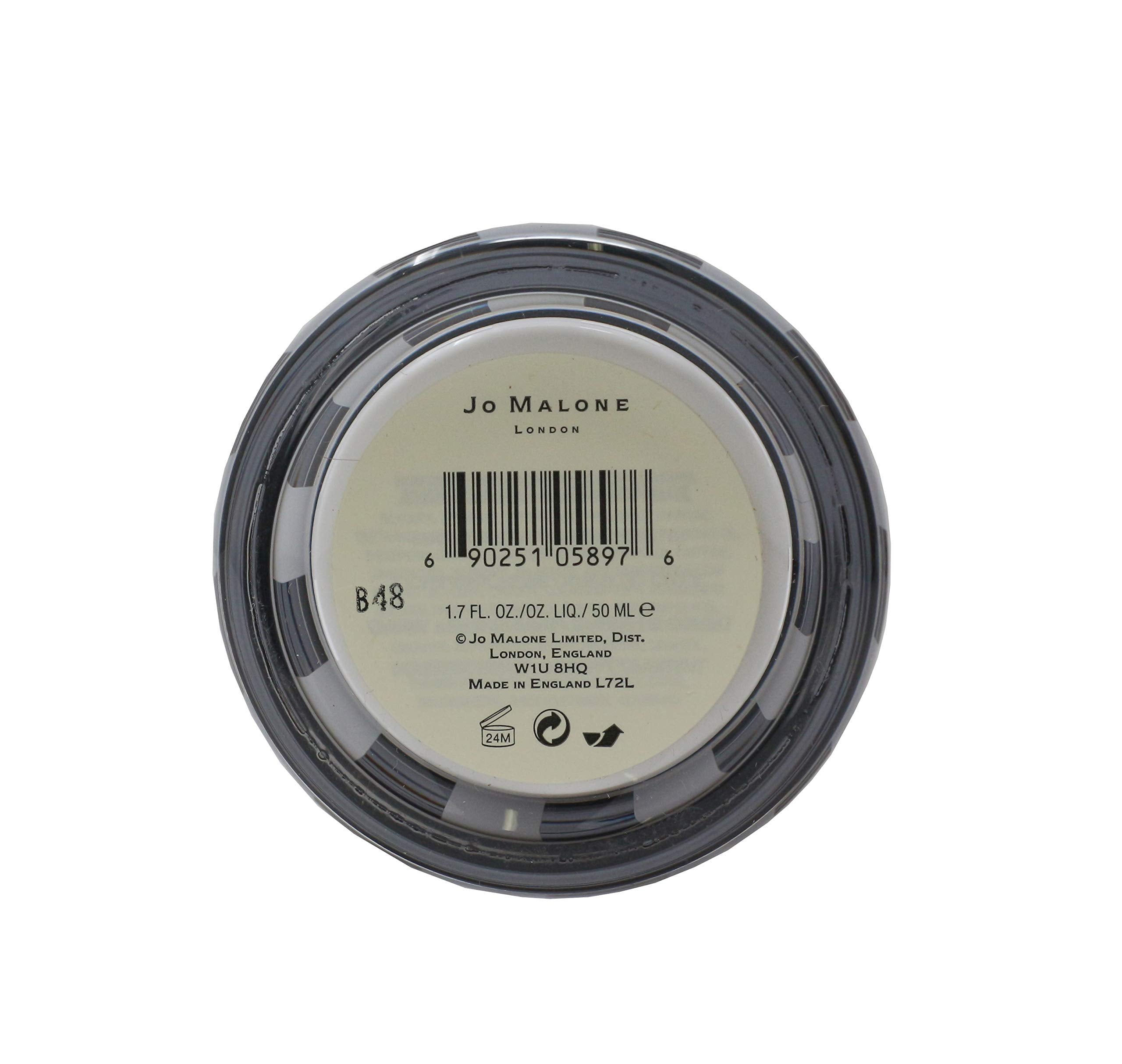 Jo Malone Lime Basil and Mandarin Body Creme texture close-up highlights creamy consistency for smooth skin.