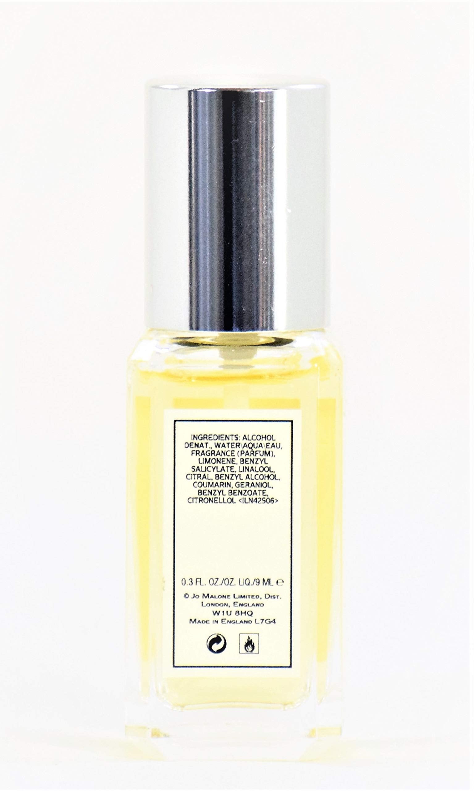 Close-up of Jo Malone Orange Bitters unboxed 0.3 oz bottle, citrus aroma in focus.